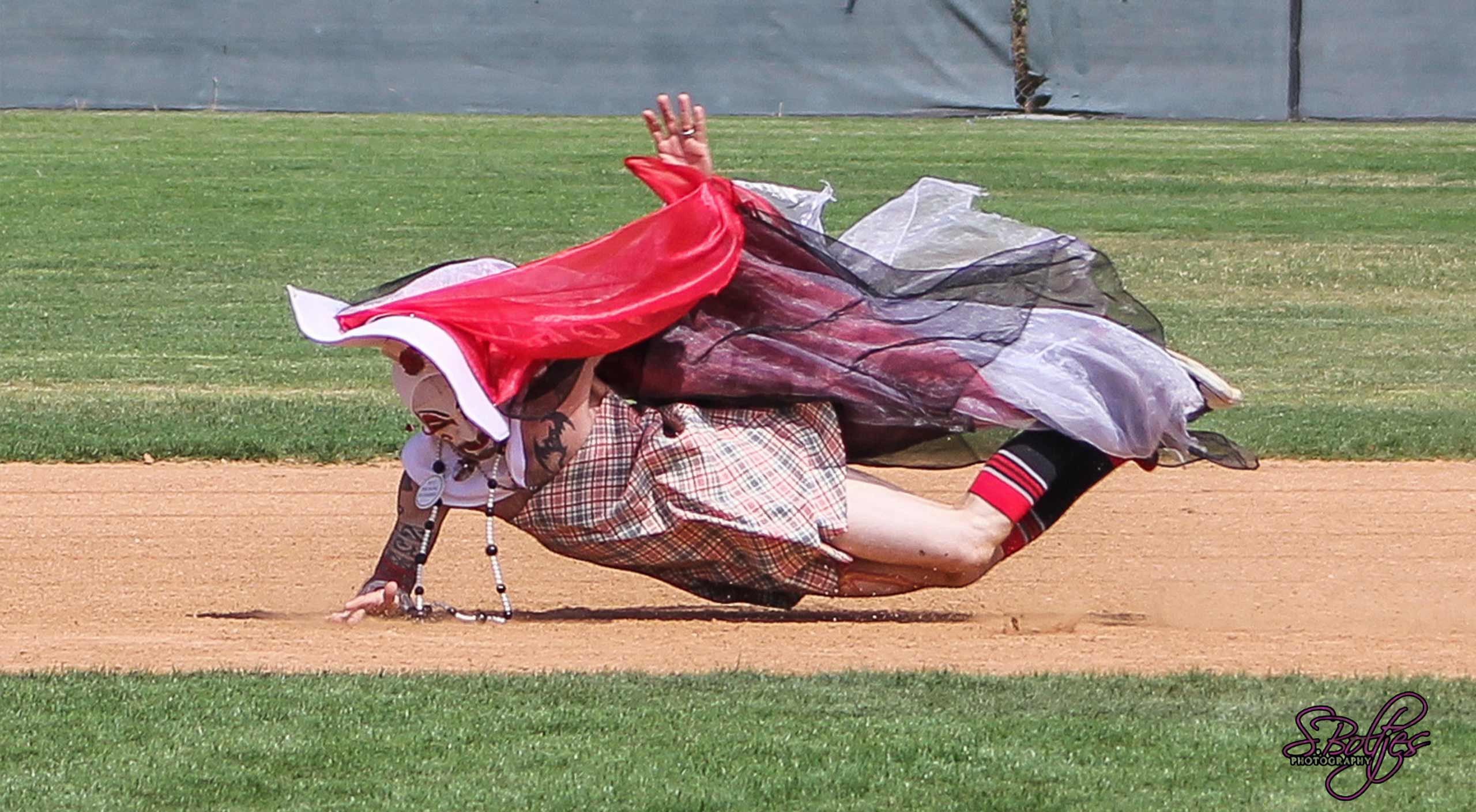 Drag Queen flying in the aid between bases